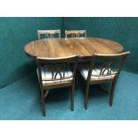 A Strongbow furniture inlaid yewwood dining table and four chairs