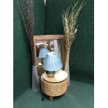 A contemporary pine framed mirror, two large glass vases containing sticks, wicker footsool,