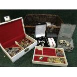 A basket of costume jewellery together with a basket of assorted brass and plated items