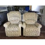 A pair of electric reclining armchairs upholstered in beige fabric
