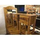 A pair of pine two drawer bedside chests together with pine wall mirror