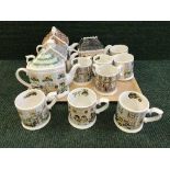 A tray of four Ringtons collector's teapots together with eight ringtons collector's mugs