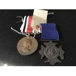 A nursing medal with ribbon together with a special constable medal with ribbon