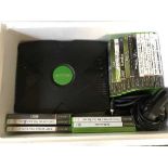 A box of Xbox with leads and controller,