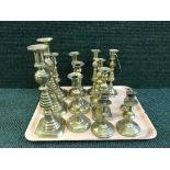 A tray of seven pairs of candlesticks