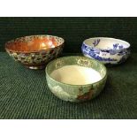 Two Cetem ware pottery bowls together with a Maling lustre bowl
