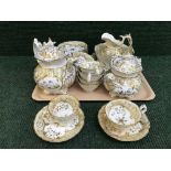 A tray of thirty piece Victorian cream and gilt tea service