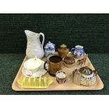 A tray of Devon ware teapots, Arthur woods tankard and preserve pot, Gibson and sons preserve pot,
