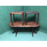 An oval mahogany coffee table together with matching lamp table