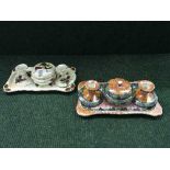 Two Maling four piece trinket sets