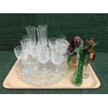 A tray of assorted glass ware, champagne flutes, glass bell,