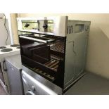 A stainless steel integrated wall oven
