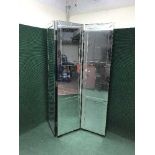 An all glass three-way room divider