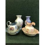 Two floral jug and basin sets together with a two floral patterned vases and lidded urn