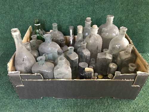 A box of vintage glass bottles