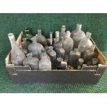 A box of vintage glass bottles