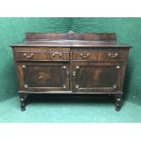 A late Victorian mahogany sideboard with brass drop handles