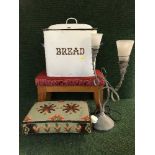 Two upholstered footstools, an enamel bread bin,