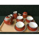 A fourteen piece Maling red Gosforth morning set together with a Maling rugby preserve pot