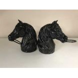 Two cast metal horse heads