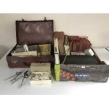 A box of miniature leather case of drawing instruments, assorted books, hair clippers,