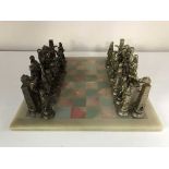 A marble chess board with metal pieces