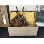 A painted pine blanket box containing two leather bags of vintage cricket equipment, tennis rackets,