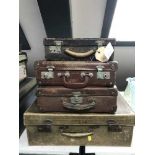 A mid 20th century pig skin luggage case and three others