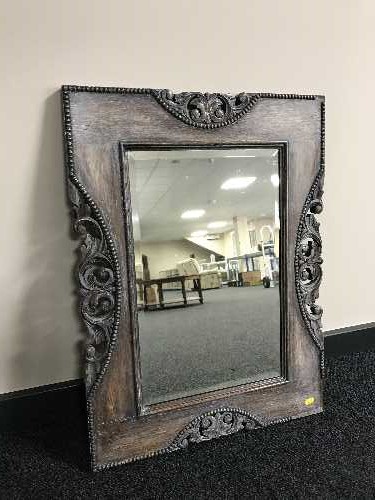 A carved oak framed Edwardian mirror