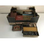 A box of assorted vintage bar games,