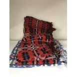 Three fringed woolen throws