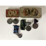 Two Coronation commemorative tins containing silver RAOB medal,