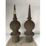 A pair of cast iron antique finials