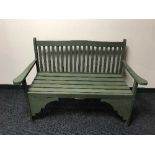 A painted wooden garden bench