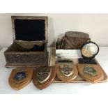 A tray of carved oak trinket box, four wooden plaques, pair of binoculars in case,