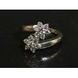 A 9ct gold diamond double cluster ring, approximately 0.5ct.