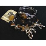 A good collection of vintage amber set jewellery comprising of bangle, dress ring,