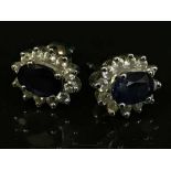 A pair of 18ct gold diamond and sapphire cluster earrings