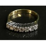 An 18ct gold seven stone diamond ring, approx 0.