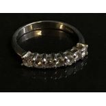 A platinum diamond half eternity ring