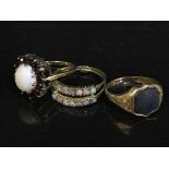 Three vintage gold rings including opal cluster,
