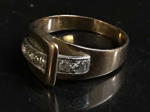 A diamond set buckle ring,