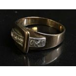 A diamond set buckle ring,