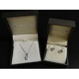 A 9ct white gold earring and necklace suite set with paste stones