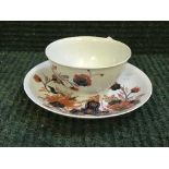 An eighteenth century English china teabowl and saucer, probably Lowestoft,