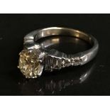 A large solitaire diamond ring in 18ct white gold, the cushion shaped old cut stone approximately 1.