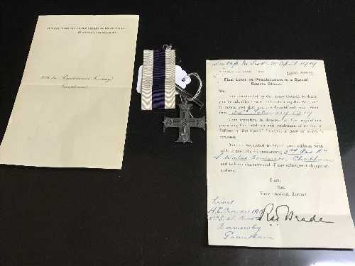 A military cross on suspension ribbon with various paperwork awarded to Captain A E Crowder,