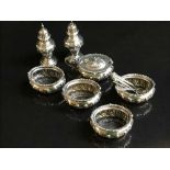 A seven piece silver cruet set by Walker & Hall, Sheffield 1901, with five matching spoons, 11.