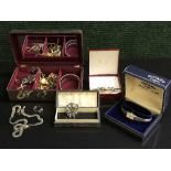 Several jewellery boxes containing a 9ct gold dress ring, costume jewellery,