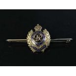 A 9ct gold and enamel Royal Engineer's bar brooch with emblem, in fitted tooled leather box, 4.